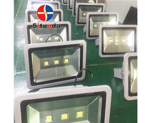 Floodlight processing and assembly